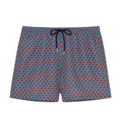 Blue swim shorts with a red pattern on a white background